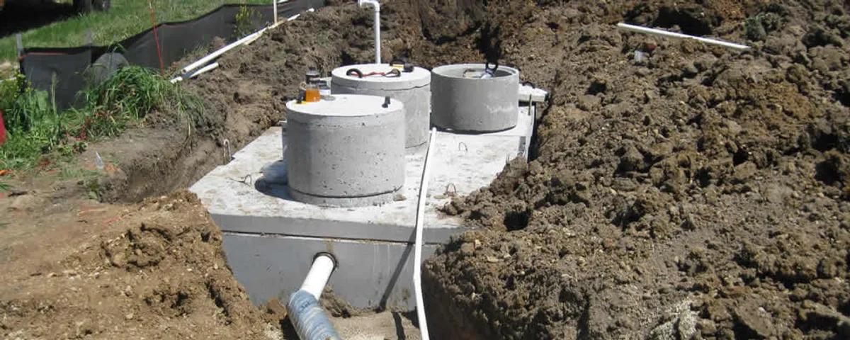 Septic system repair and installation site with tank access ports in Naperville, IL