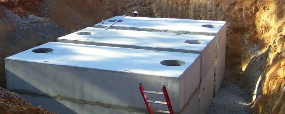 Septic tank installation site with a newly placed concrete tank in Naperville, IL